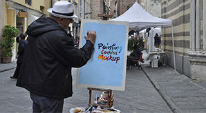 Free-Painter-Painting-on-Canvas-Mockup-PSD