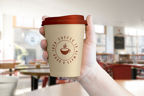 Free-Hand-Holding-Coffee-Cup-Mockup-PSD-File