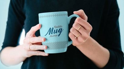 Free-Mug-in-Female-Hand-Mockup-PSD-3