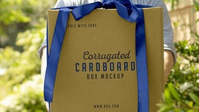 Free-Hand-Holding-Corrugated-Cardboard-Box-Mockup-PSD-File