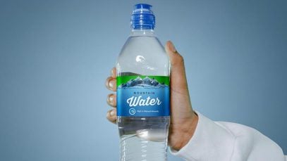 Free-Hand-Holding-Water-Bottle-Label-Mockup-PSD-2