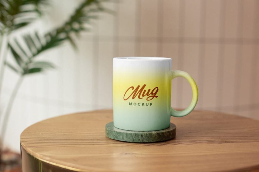 Free Mug on the Coaster Mockup PSD - Designbolts
